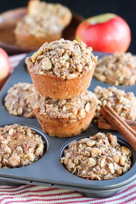 Apple muffins on a muffin tin.