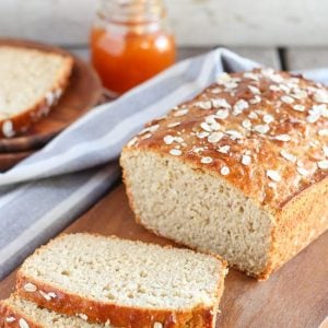 Loaf of bread on a wooden cutting board.