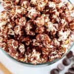Chocolate popcorn in a glass bowl.