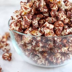 Chocolate popcorn in a glass bowl.