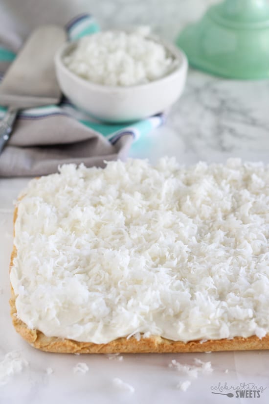 Pan of sugar cookie bars topped with coconut.