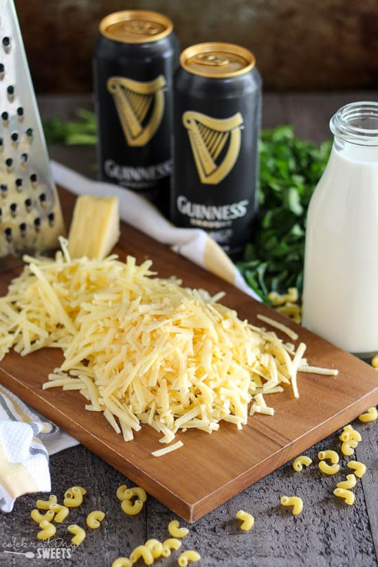 Grated cheese on a wooden board.