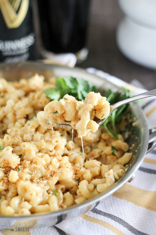 Macaroni and cheese in a skillet with a fork.