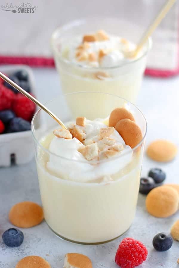 Vanilla pudding in a glass with vanilla wafer cookies.