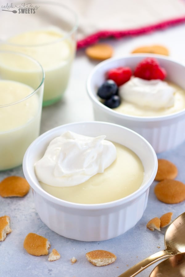 Vanilla pudding in a white ramekin with berries.