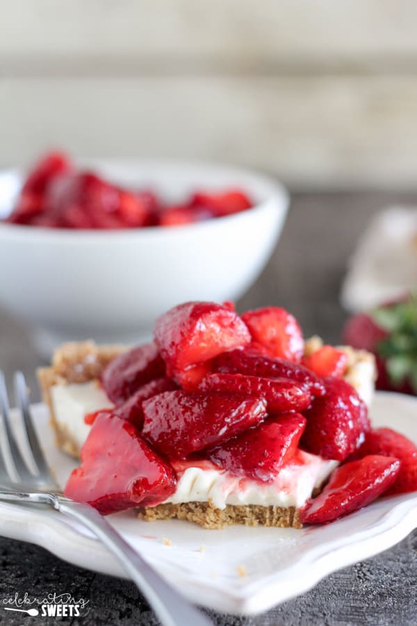 Piece of strawberry pie on a pie plate.