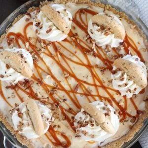 Ice cream pie topped with caramel sauce and cookies.