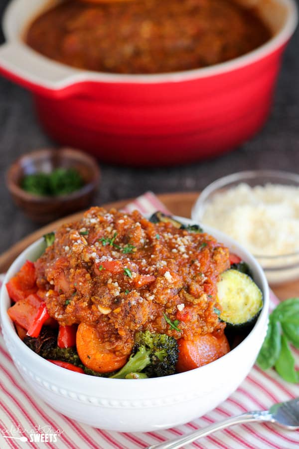 Roasted vegetables topped with meat sauce. 
