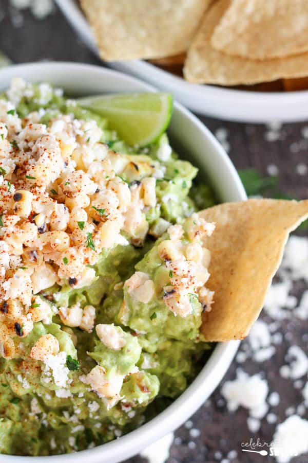 A bowl of food on a plate, with Guacamole and Cotija cheese