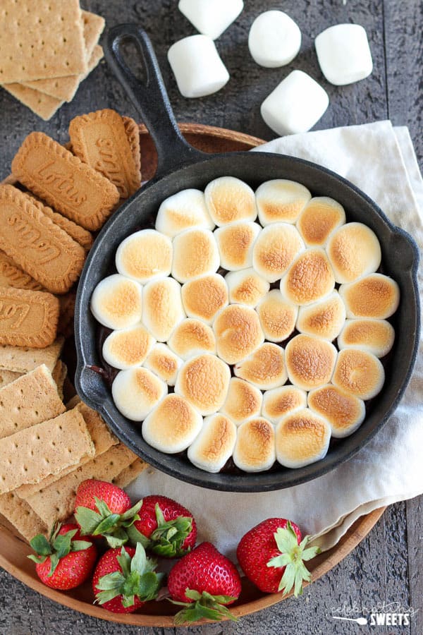 Skillet s\'mores dip topped with toasted marshmallows.