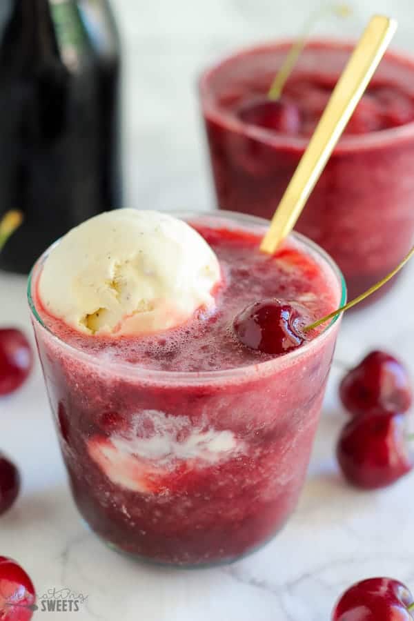 Cherry daiquiri topped with a scoop of vanilla ice cream.