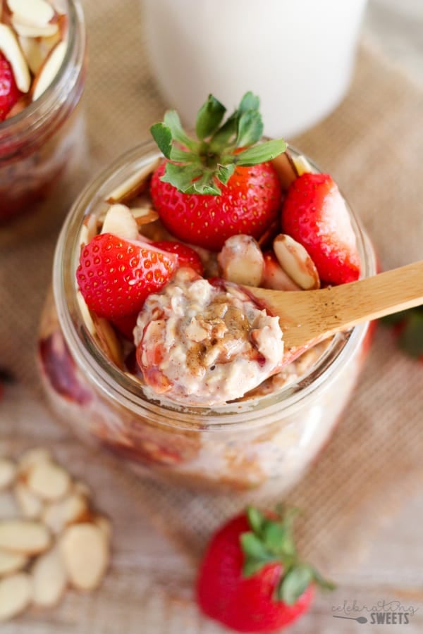 Overnight oats in a jar with strawberries and almond butter. 