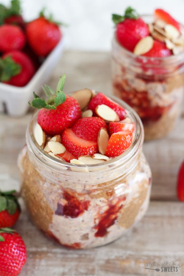 Overnight oats in a jar with strawberries and almond butter. 