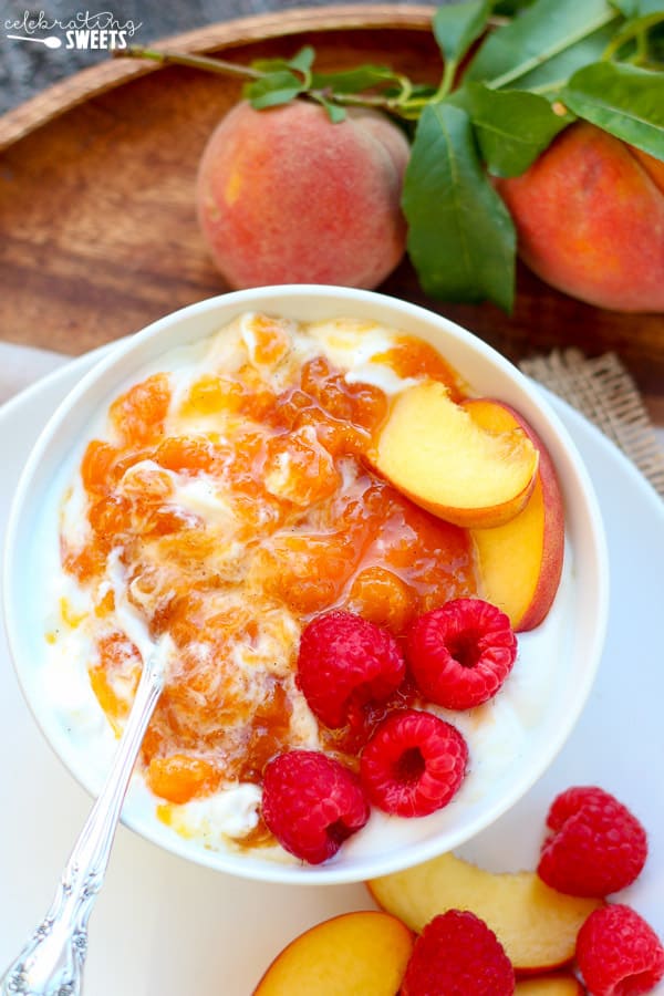 Yogurt topped with jam and fruit.