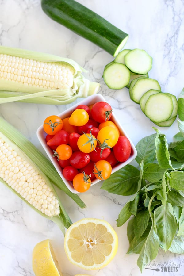 Tomatoes, zucchini, corn, basil.