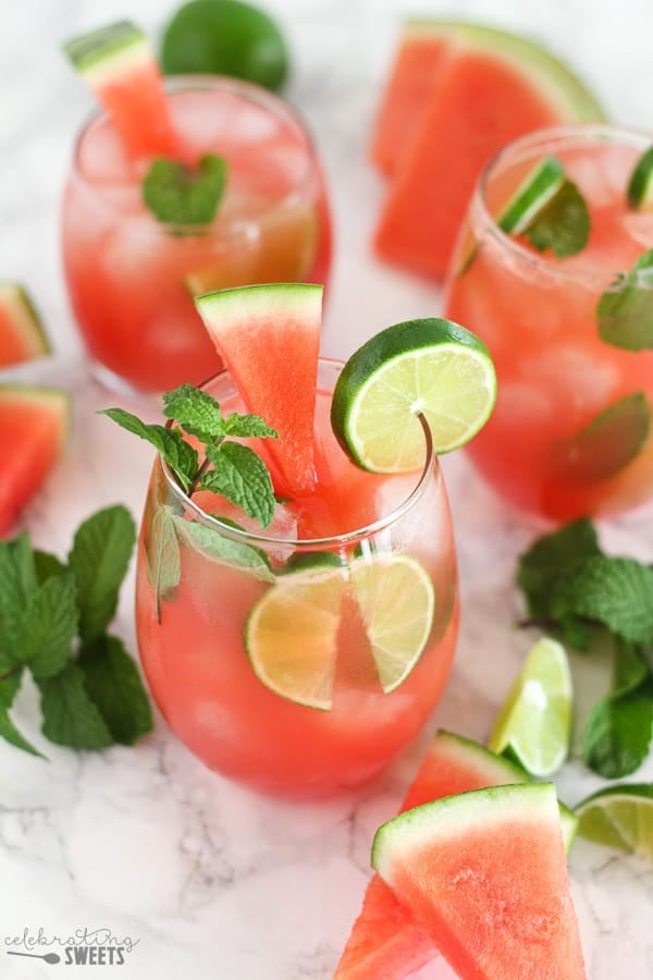 Watermelon mojito garnished with lime and mint.