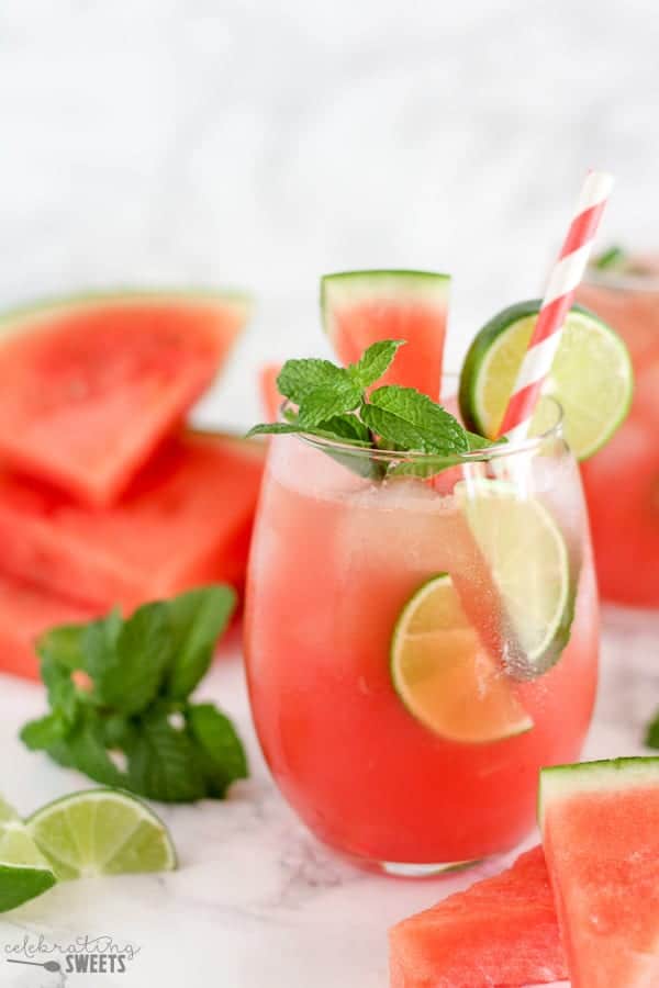 Watermelon mojito garnished with lime and mint. 