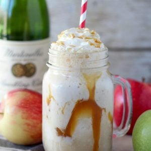 Apple cider float in a mason jar with caramel sauce.