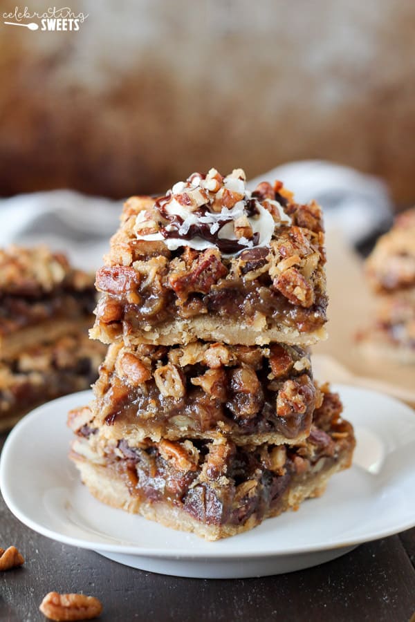 Stack of pecan pie bars with chocolate and coconut