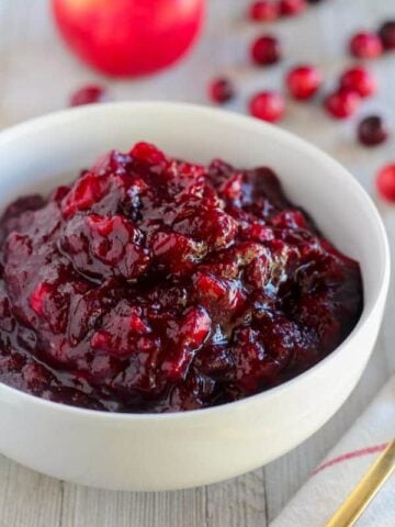 Cranberry sauce in a white bowl.