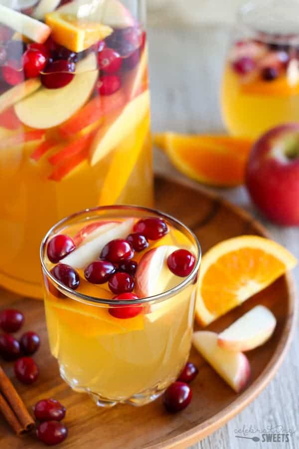 Apple cider sangria with cranberries, orange and apple slices. 