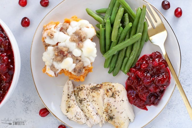 Thanksgiving dinner - turkey, sweet potato casserole, green beans and cranberry sauce.