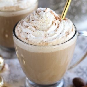 Eggnog latte topped with whipped cream.