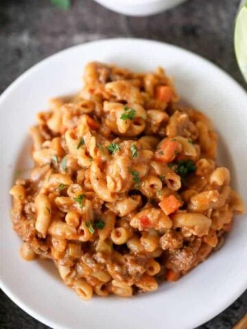 Macaroni casserole on a white plate.