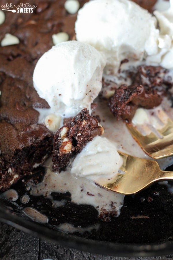 Chocolate skillet cookie topped with ice cream.