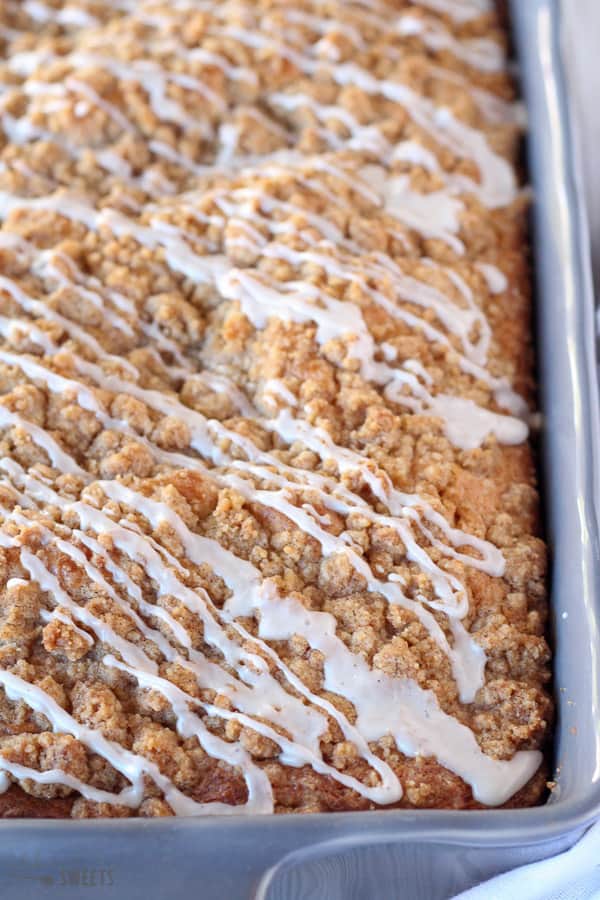 Crumb cake drizzled with icing.