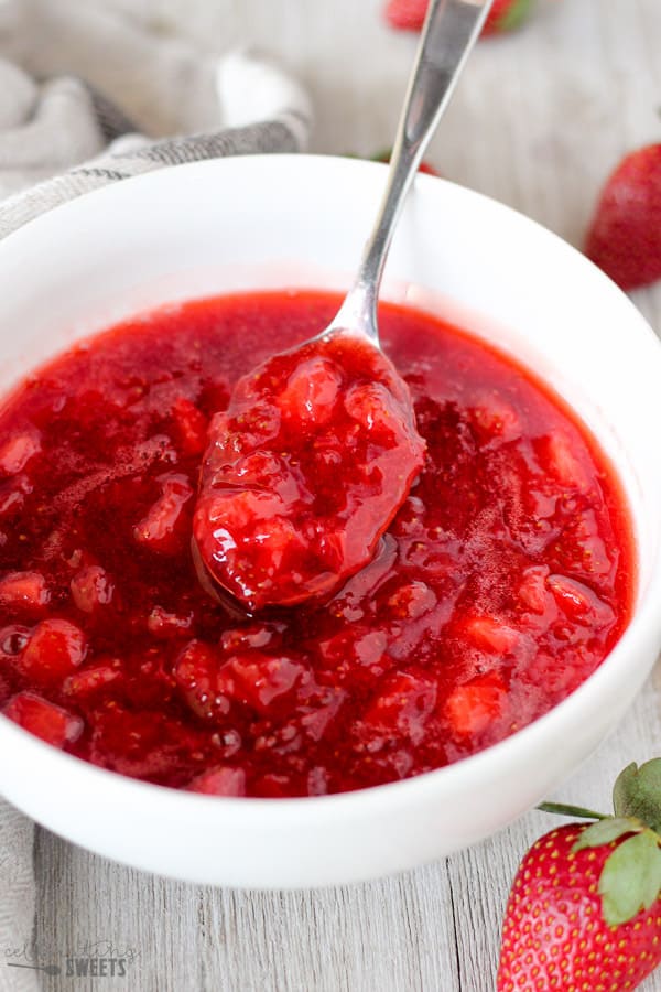Strawberry sauce in a white bowl.