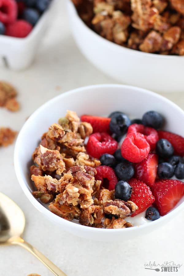 Bowl of granola with yogurt and berries.