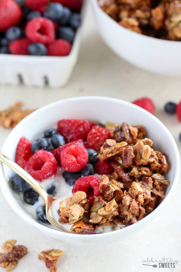 Bowl of granola with yogurt and berries.