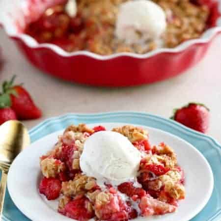Easy Strawberry Crisp - Sweet and juicy strawberries topped with a buttery brown sugar oat crumble. This delicious fruit crisp comes together in minutes and it is sure to be a crowd pleaser.