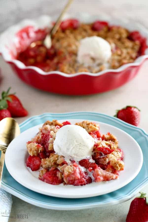 Strawberry crisp topped with ice cream.