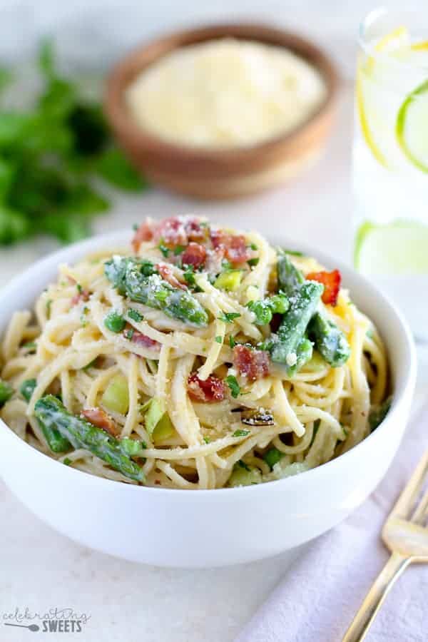 Bowl of pasta with asparagus and bacon. 