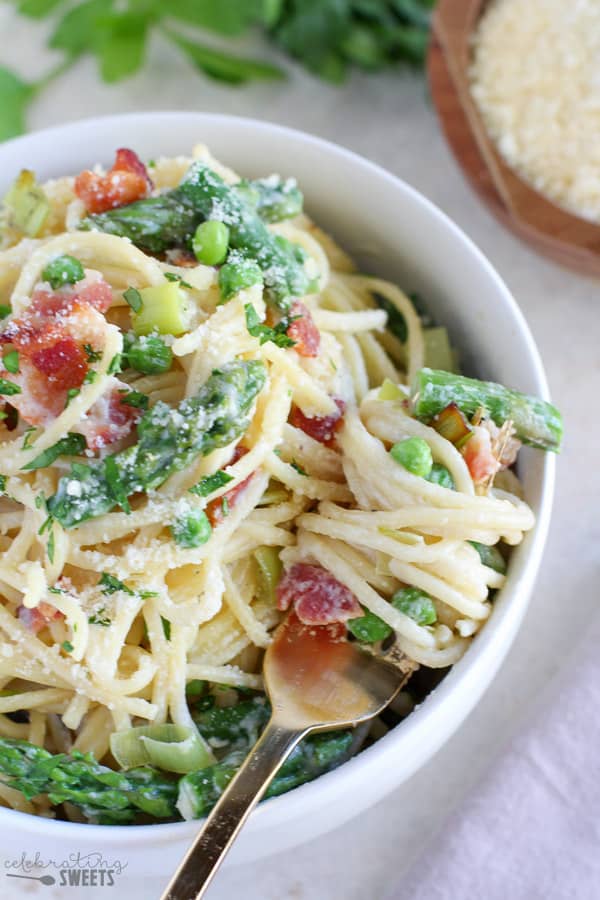 Bowl of pasta with asparagus and bacon. 
