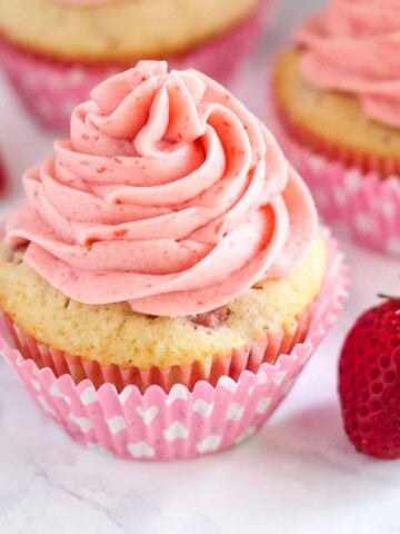 Close up of Strawberry Cupcake topped with strawberry buttercream