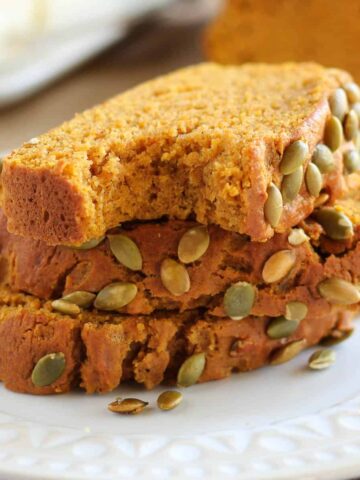 Slices of healthy pumpkin bread on a white plate.