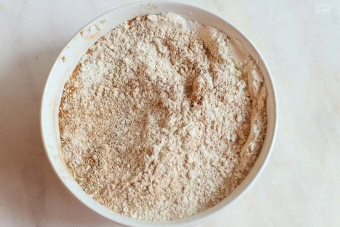 Flour and spices in a white bowl.