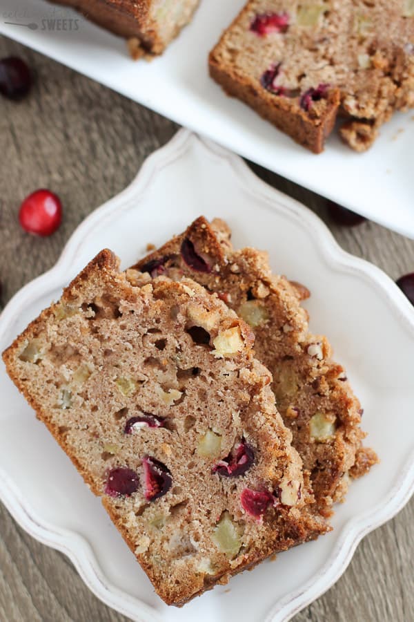 Two slices of cranberry bread on a white plate.