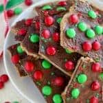 This festive Christmas Bark is easy and delicious! Layers of graham crackers, brown sugar toffee, peanut butter, and chocolate make this an addictive holiday treat.