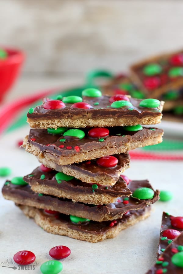 A stack of Graham Cracker Toffee Bark with red and green M&M's
