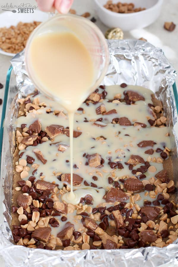 Drizzling Sweetened Condensed Milk on Magic Cookie Bars