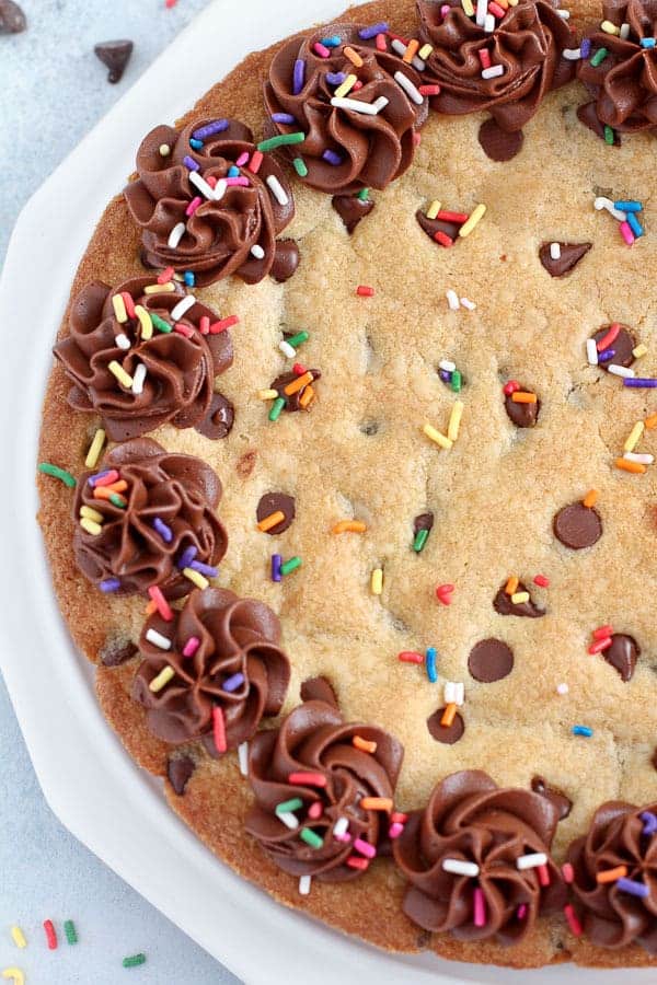 Chocolate Chip Cookie Pie topped with chocolate frosting and sprinkles. 