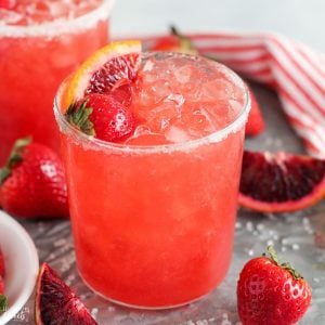 Strawberry Margarita in a glass with crushed ice.