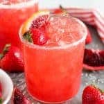 Strawberry margarita in a sugar rimmed glass.