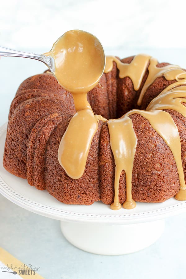 Glaze being poured onto banana cake