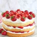 Strawberry Shortcake Cake topped with strawberries.