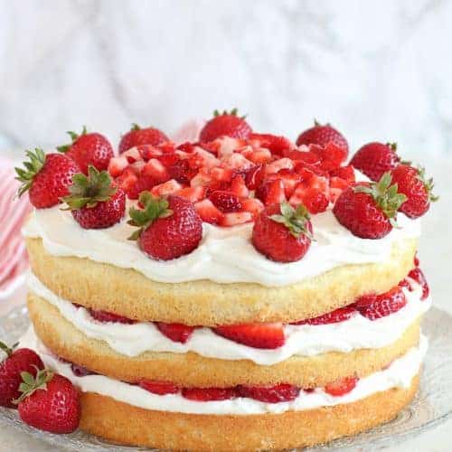 Strawberry Shortcake Cake topped with strawberries.